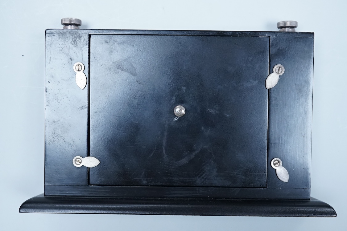 Two modern silver mounted ebonised desk calendars, including one retailed by Asprey, width 21.3cm and a modern silver mounted photograph frame.